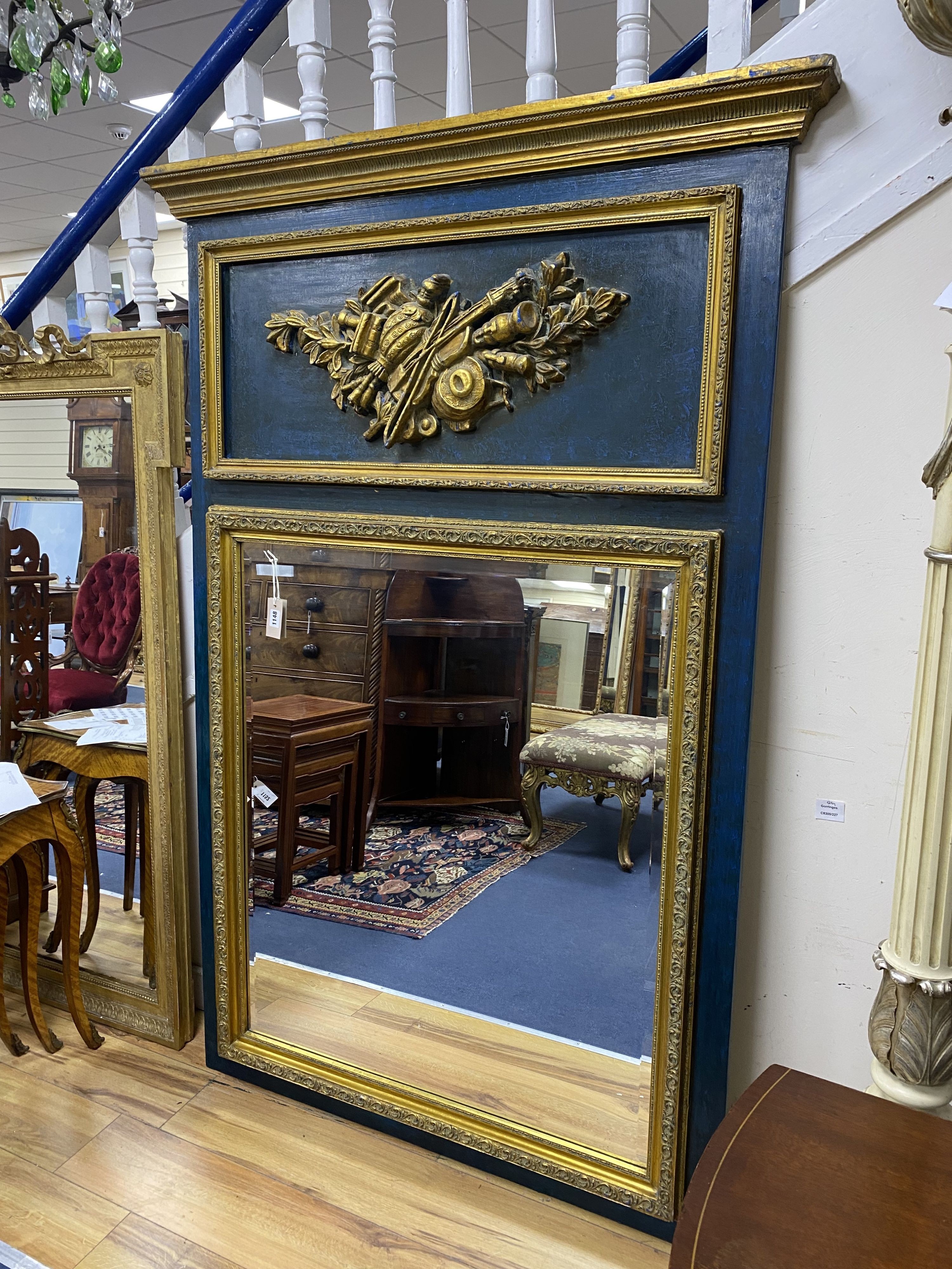 A 19th century French overmantel gilt and gesso mirror with musical themed emblem over on blue background, width 114cm, height 172cm